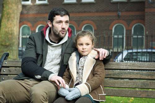 father and daughter on bench
