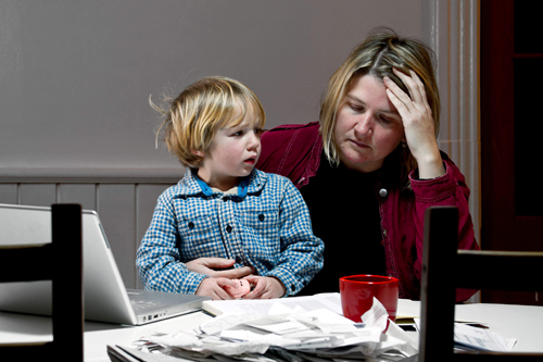 overwhelmed woman with son