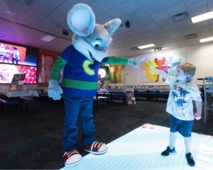 Chuck E Cheese and kid