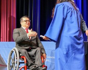 Stefan Bean congratulates a graduate